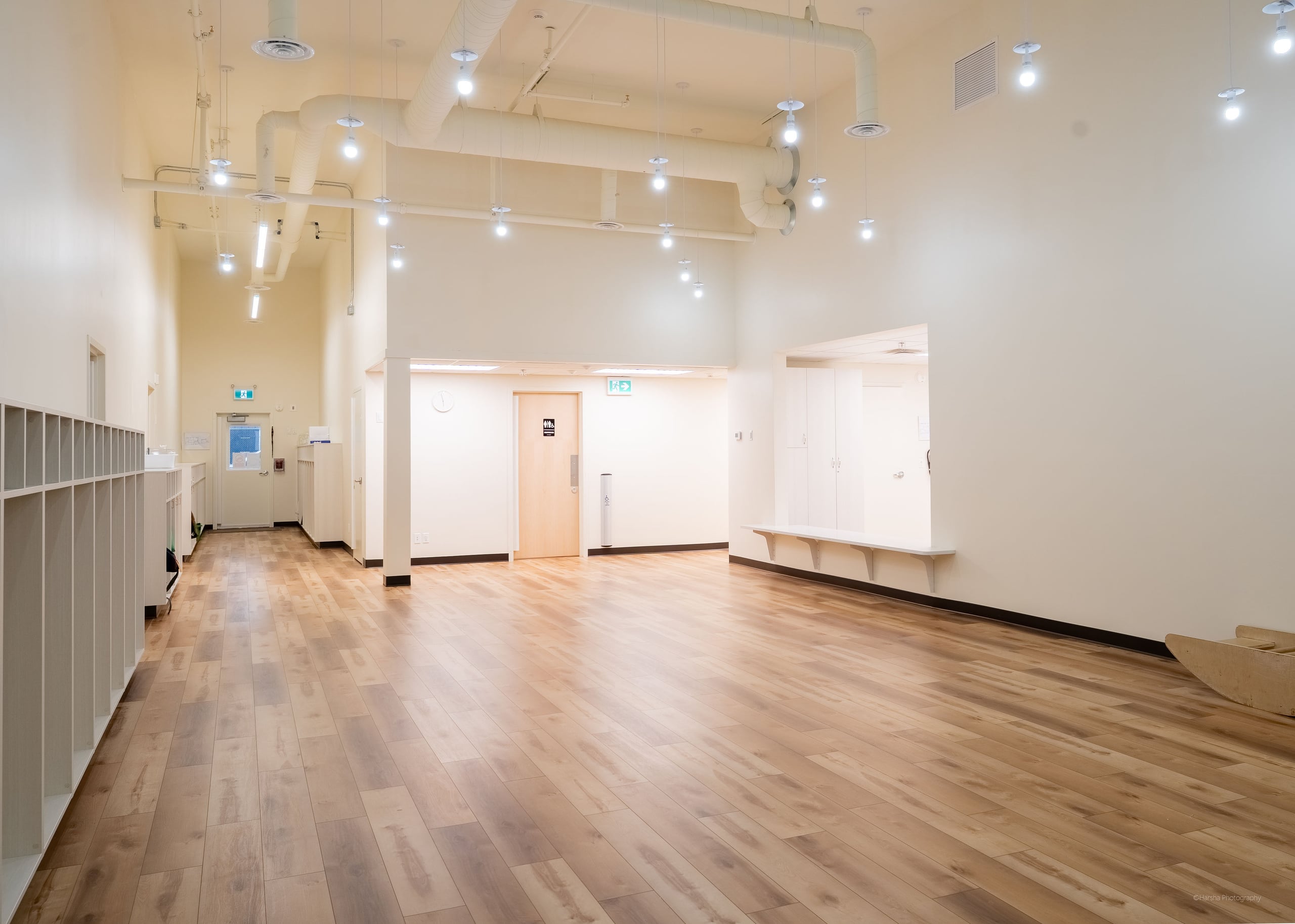 A bright hall with warm wood floors